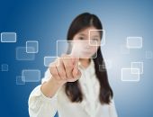 picture of computer technology  - Business woman pressing on a flow of buttons - JPG 