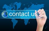 foto of contact  - women hand writing contact us and world - JPG 