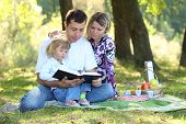 image of nature  - young family read the Bible in nature - JPG 