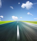 picture of blue sky  - Blurry asphalt road and clear blue sky with clouds - JPG 