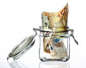 stock photo of investment  - Glass money jar of Euro banknotes - JPG 
