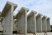 stock photo of incorporate  - Precast concrete shapes are awaiting incorporation into a new bridge construction project - JPG 