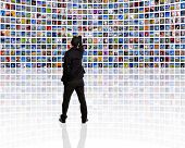 picture of science  - Back view of a young man watching a big TV panel - JPG 