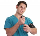 image of bloodpressure  - A doctor taking his blood pressure in scrubs - JPG 