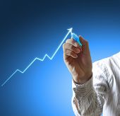 pic of future  - Male hand drawing a graph - JPG 