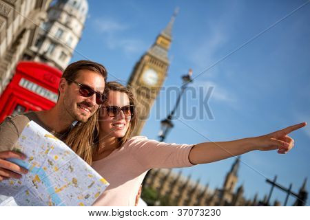 Picture or Photo of Couple of tourists in London holding a map