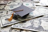 image of college  - a mini college graduation cap on cash - JPG 