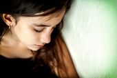 image of depth  - Emotional portrait of a sad girl with a shallow depth of field and space for text - JPG 