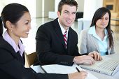 image of business people  - A diverse attractive man and woman business team in meeting - JPG 