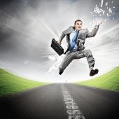 stock photo of future  - Young businessman in suit running on the road - JPG 