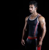 pic of fitness  - Portrait of a young fit athlete in sportswear against black background with copy space - JPG 