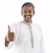 stock photo of man  - Excited thumb up Indian man in traditional costume kurta dhoti isolated on white background - JPG 