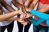 foto of team  - Team of friends showing unity with their hands together - JPG 