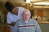 stock photo of home  - the loving touch of nursing staff has a great effect on a nursing home resident - JPG 