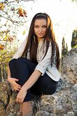 foto of outdoor  - Young brunette woman outdoors portrait girl female - JPG 