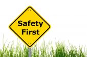 stock photo of safety  - yellow sign with safety first as aid concept - JPG 