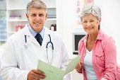 stock photo of medical doctors  - Doctor with female patient - JPG 
