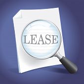 picture of magnifying  - Examining a Lease Agreement with a Magnifying Glass - JPG 