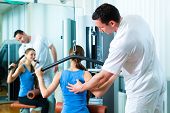 stock photo of sports  - Patient at the physiotherapy making physical exercises with her therapist - JPG 
