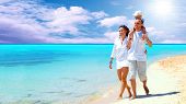 picture of beach  - View of happy young family having fun on the beach - JPG 