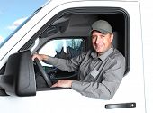 image of transportation  - Smiling truck driver in the car - JPG 