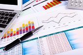 foto of investment  - Financial paper charts and graphs on the table - JPG 