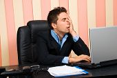 image of failure  - Stressed business man with problems on laptop holding face in his hand - JPG 