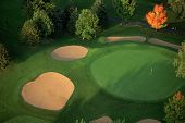 foto of golf  - sand traps surround a putting green on the golf course at the interlachen country club - JPG 