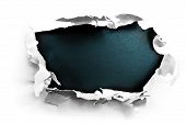 stock photo of pressure  - Breakthrough paper hole with black textured background - JPG 