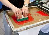 stock photo of pressure  - manual screen printing - hand printing t-shirts
** Note: Slight blurriness, best at smaller sizes - JPG 