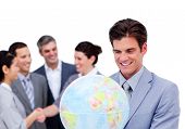 image of blue sky  - Charismatic manager and his team holding a terrestrial globe against a white background - JPG 