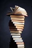 picture of education  - Pile of books on a black background - JPG 