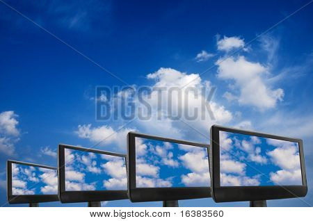 Picture or Photo of Conceptual image for cloud computing, with monitors displaying clouds on screen