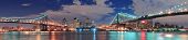 picture of bridge  - Manhattan Bridge and Brooklyn Bridge panorama over East River at night in New York City Manhattan with lights and reflections - JPG 