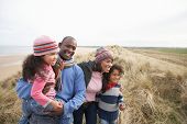 image of family  - Black Family on a beach - JPG 