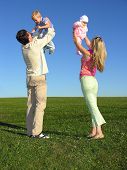 picture of blue sky  - happy family with two children on blue sky - JPG 