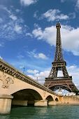 foto of france  - Vertical oriented photo of Eiffel Tower and fragment of bridge over the Seine River in Paris - JPG 