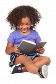 stock photo of reading  - Student little girl reading with a book isolated over white - JPG 