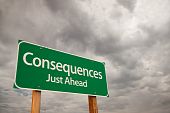 stock photo of outcome  - Consequences Just Ahead Green Road Sign with Dramatic Storm Clouds and Sky - JPG 