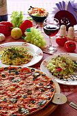 image of food  - Classic Italian food setting with pizza pasta salad and wine - JPG 