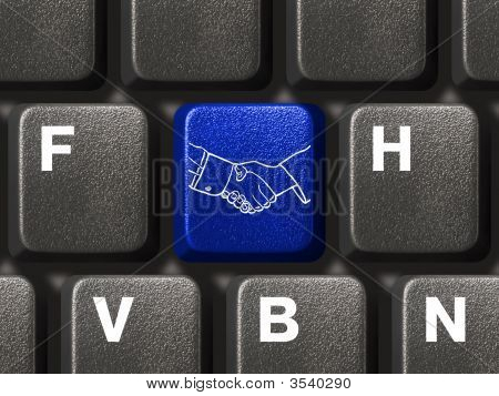 Picture or Photo of Computer keyboard with handshake button business concept