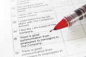 image of survey  - closeup of a blank employment survey with red pen - JPG 