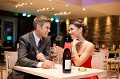 pic of restaurant  - Young couple on first date in romantic restaurant - JPG 