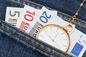 stock photo of watch  - Pocket watch with chain in jeans and money euro - JPG 