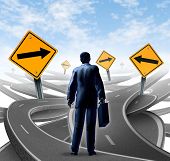 image of right  - Strategic journey as a business man with a breifcase choosing the right strategic path for a new career with blank yellow traffic signs with arrows tangled roads and highways in a confused direction - JPG 