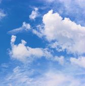 stock photo of blue sky  - nice scenic fluffy clouds with deep blue sky - JPG 