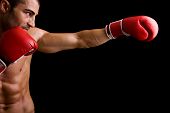 stock photo of fitness  - Young Boxer fighter over over black background - JPG 