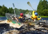 picture of oared  - Kayaker extreme sporting a kayak cuts through water - JPG 