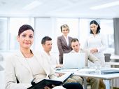 image of people  - Group of five young business people working at office with businesswoman sitting in front - JPG 