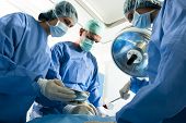 stock photo of medical doctors  - Portrait of team of surgeons at work - JPG 